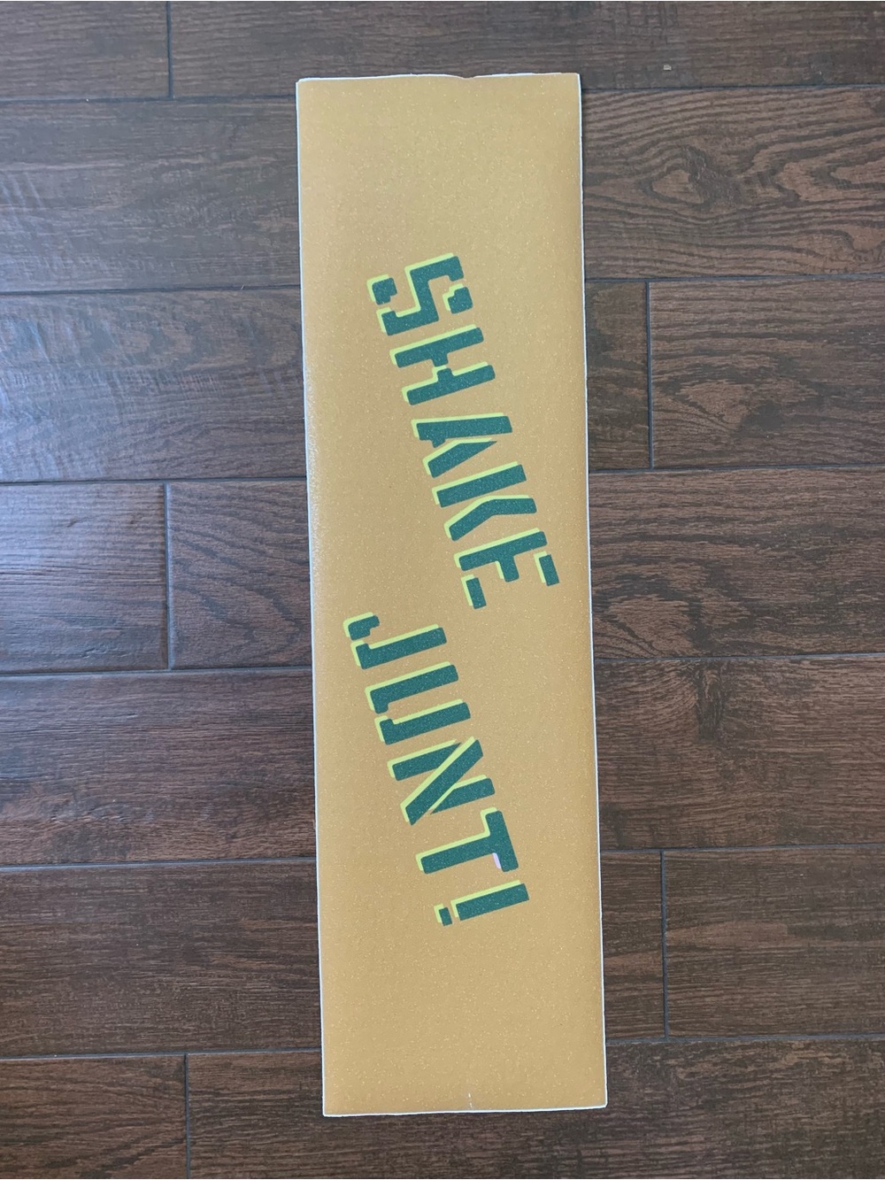 Shake junt gold and green skateboard grip tape